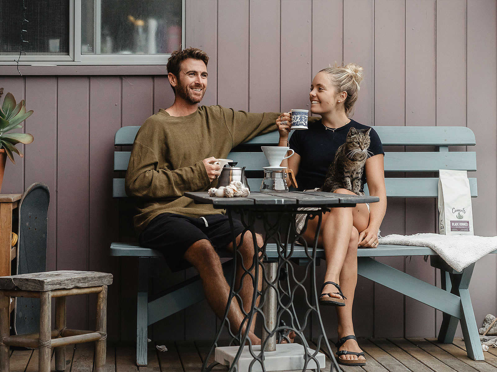 Two people having coffee on veranda